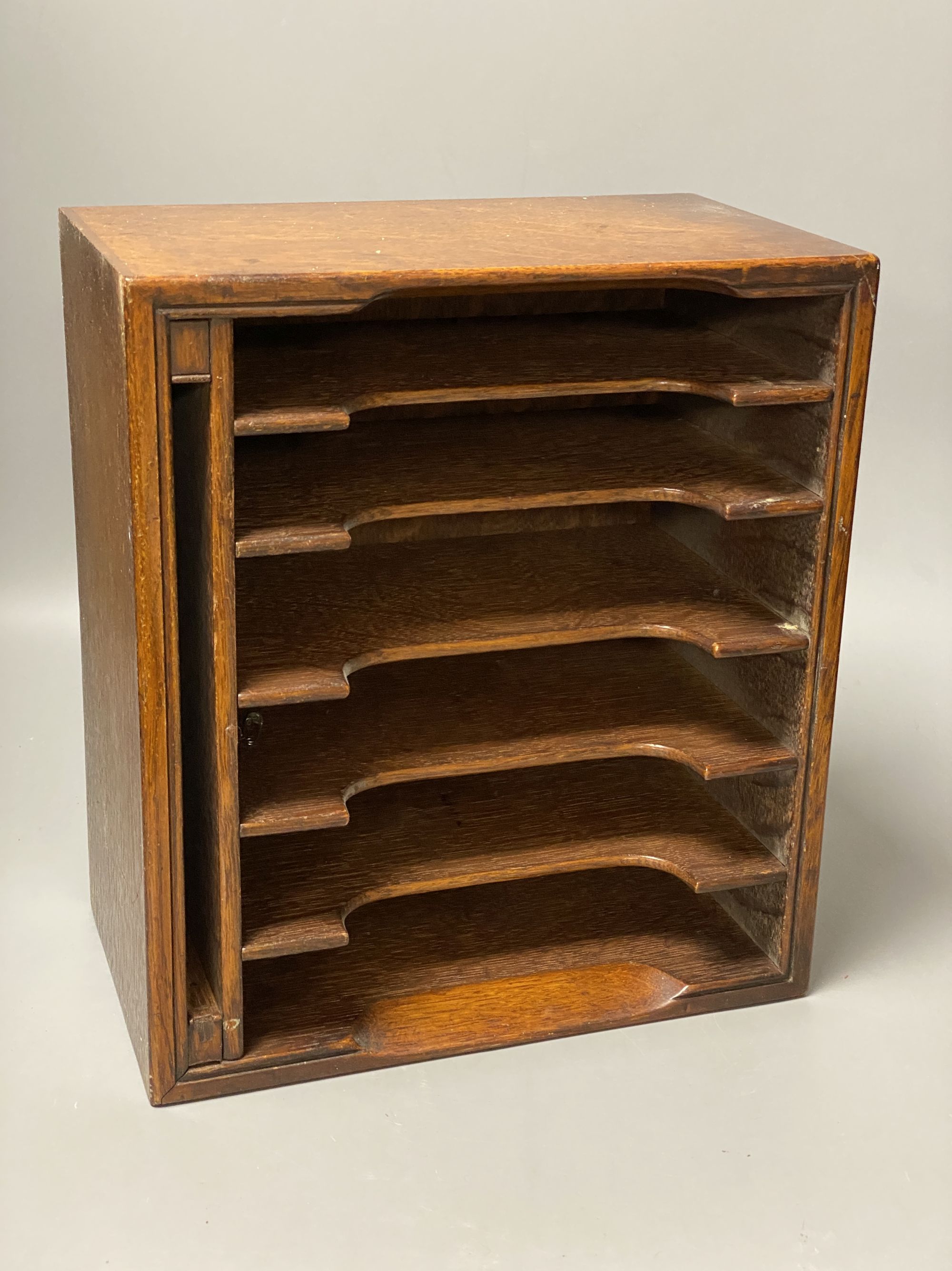 An Edwardian oak stationery box, height 29cm